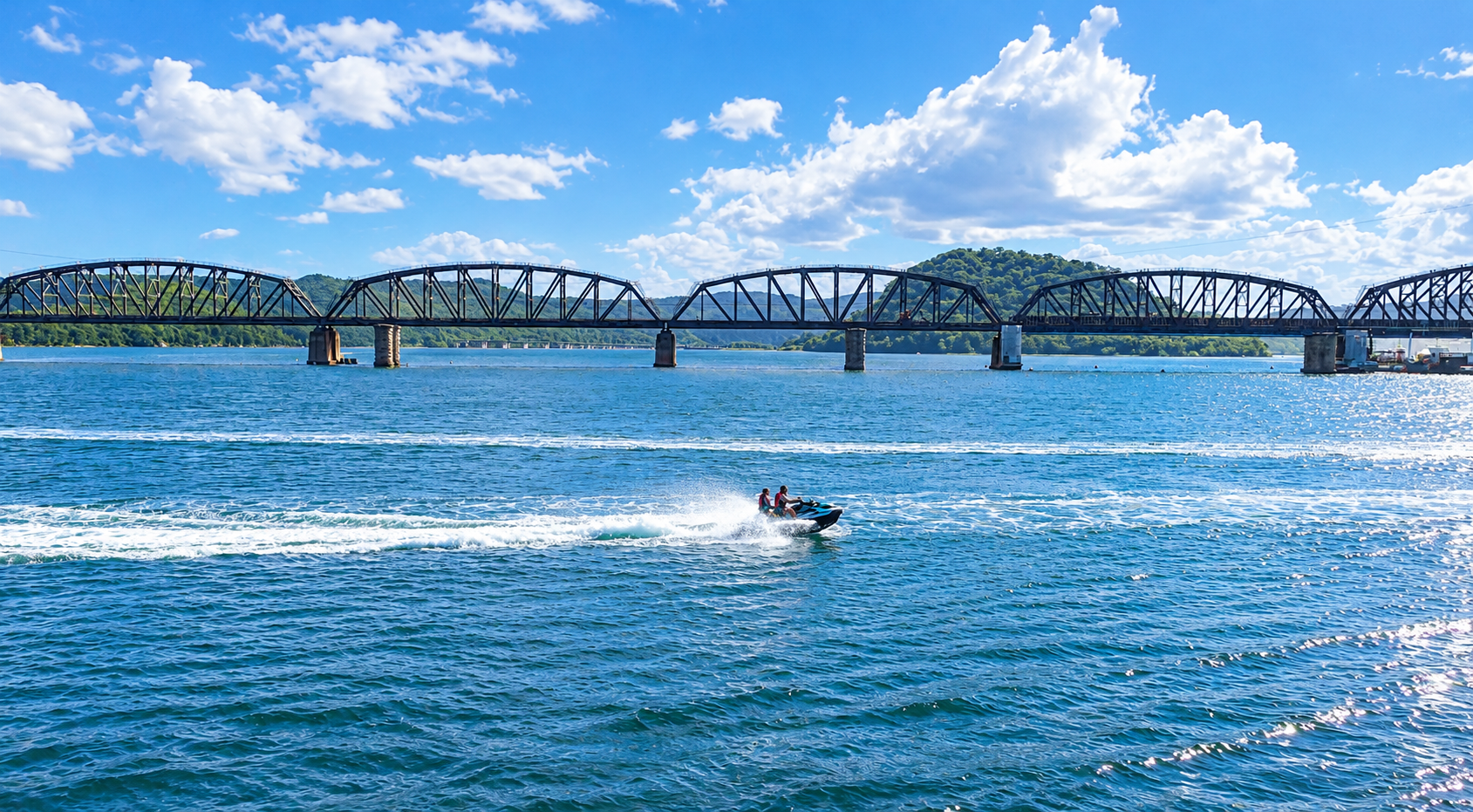 Jet Ski Beneath the Riverside Truss Bridge